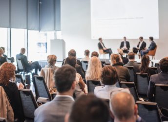 Interview and round table discussion at business convention and presentation. Audience at the conference hall. Business and entrepreneurship symposium.