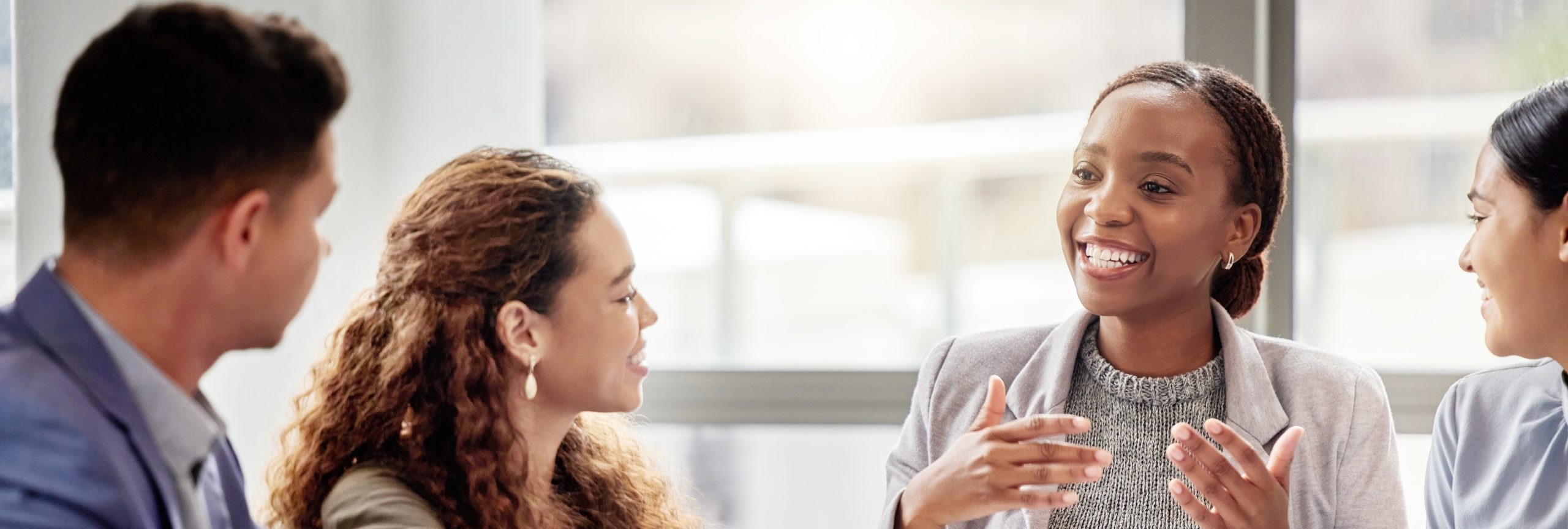 Discussion, meeting and business people in office for teamwork, planning or review at table. Collaboration, professional and group of diverse employees for ideas, conversation or project development